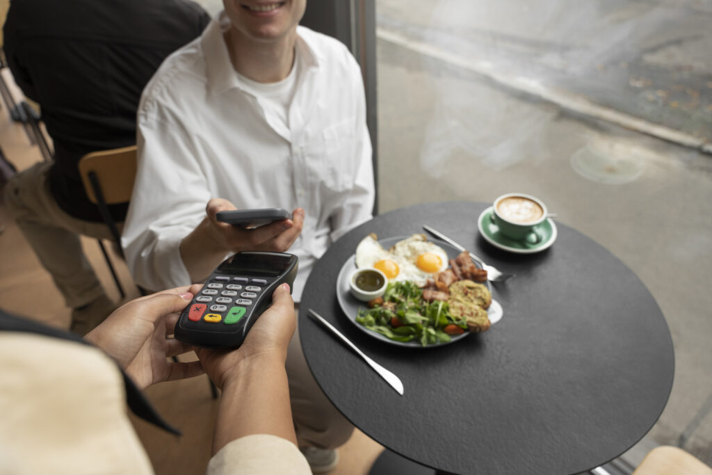 Visual showing factors like number of adults, children, dining plan, and extra charges affecting total meal cost.